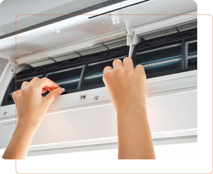 A person is working on an air conditioner.