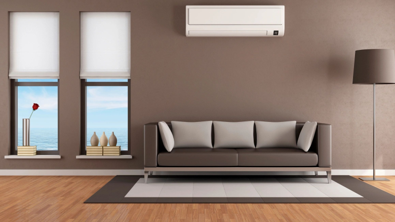 A living room with brown walls and white ceiling.